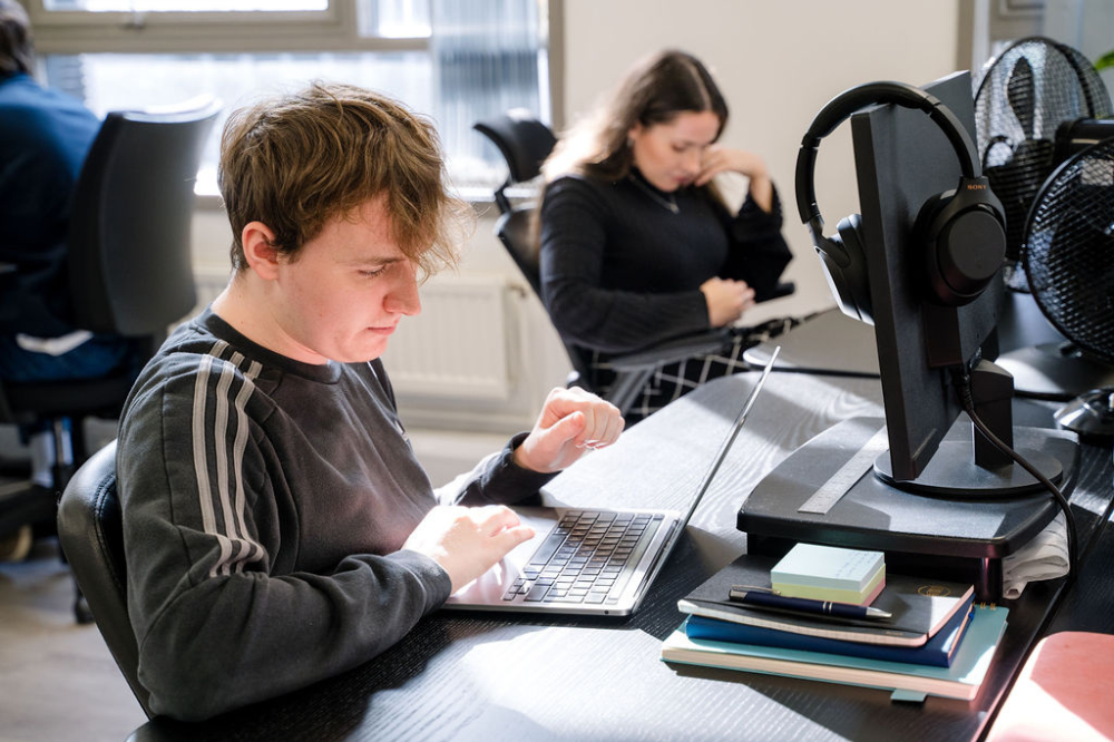 A member of our team working on their laptop